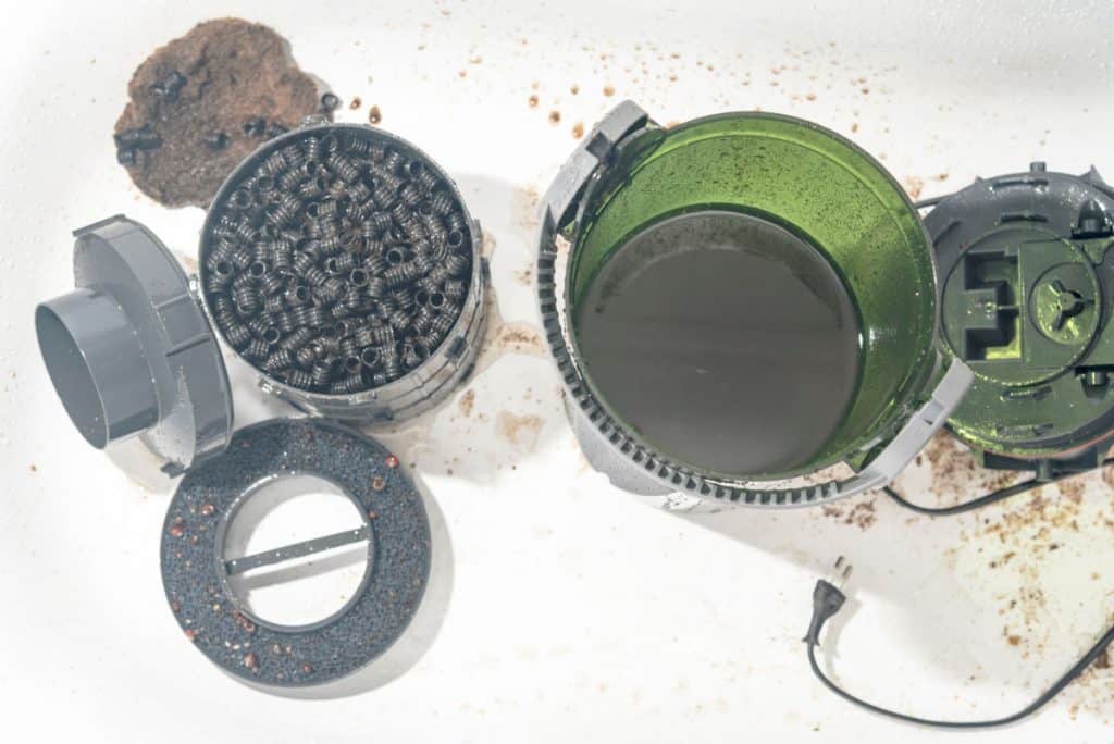 A canister filter taken apart showing the insides and workings