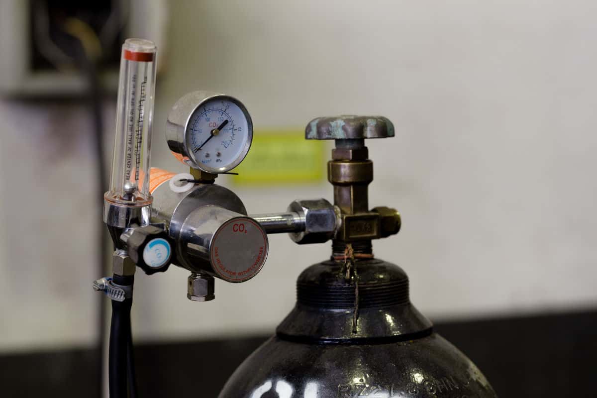 Top of a CO2 cylinder with a regulator attached